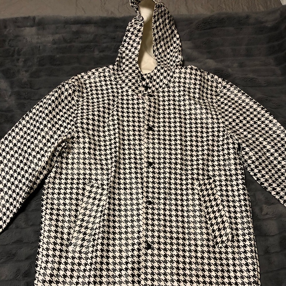 Black and white rain coat